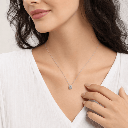 Model wearing the four-prong moissanite pendant necklace