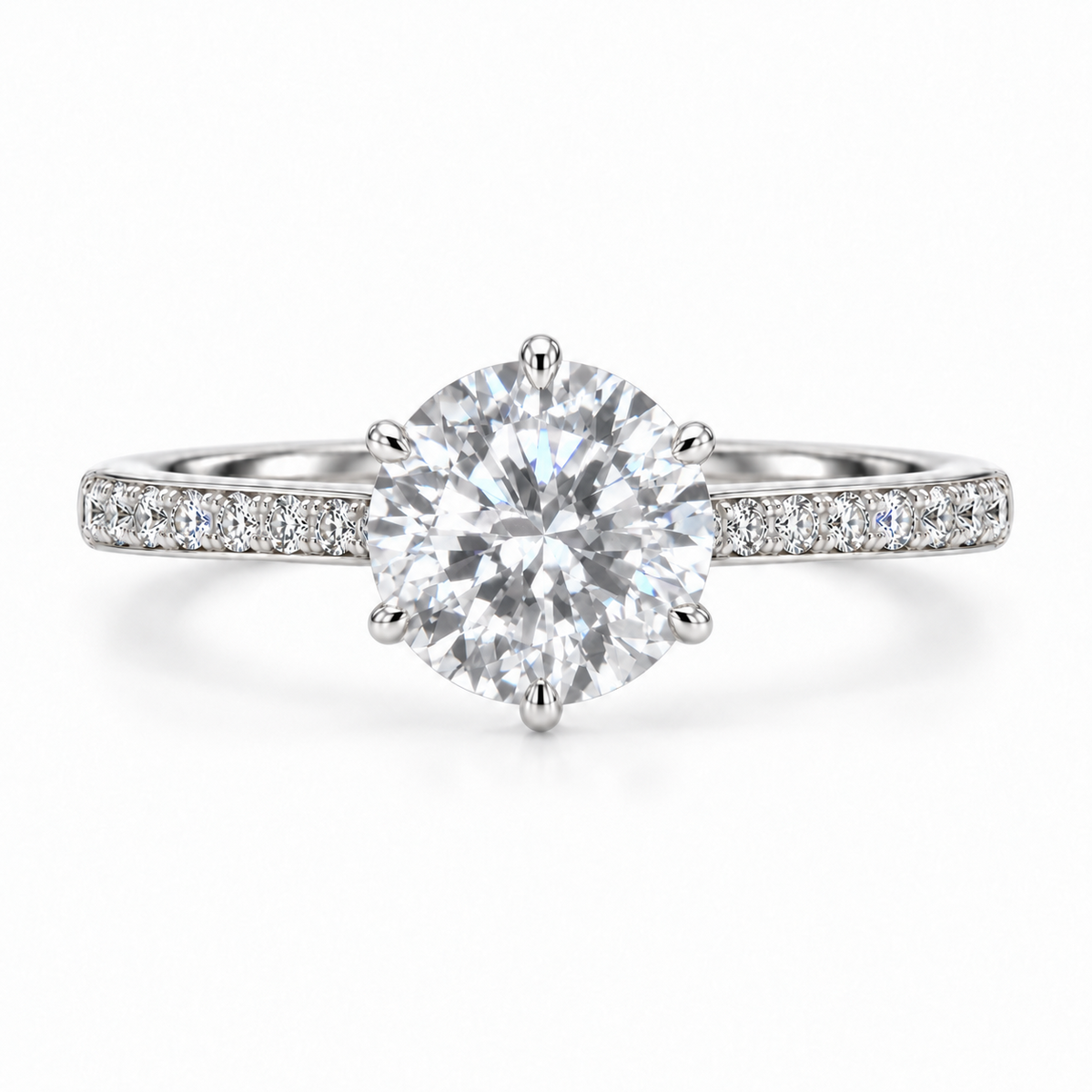 Front view of a round moissanite ring with six prongs and single-row pavé silver shoulders.