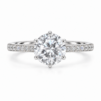 Front view of a round moissanite ring with six prongs and single-row pavé silver shoulders.