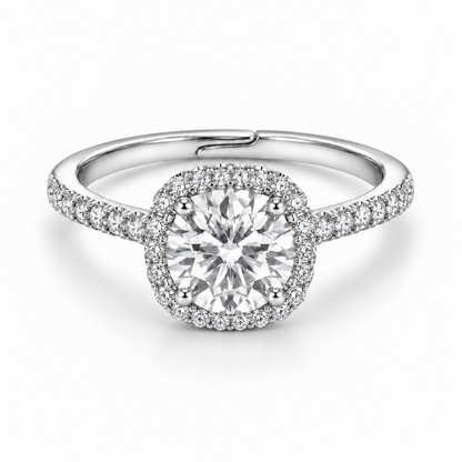 Front view of a 1 ct round white moissanite ring with a cushion-shaped halo, four prongs and pavé shoulders in 925 sterling silver.