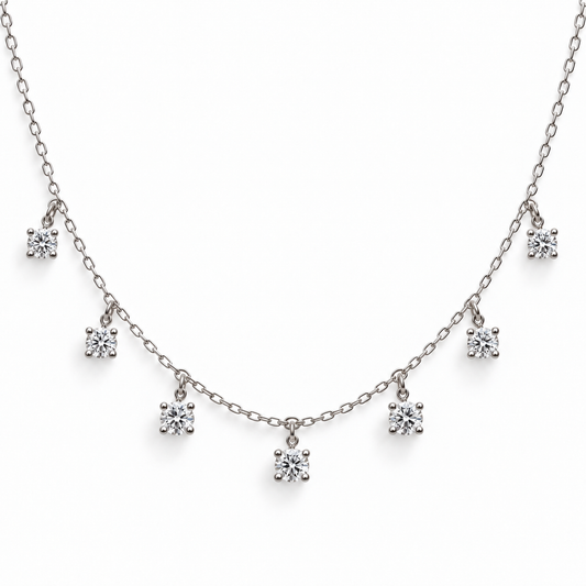 Seven-stone round moissanite necklace in 925 sterling silver on a white background